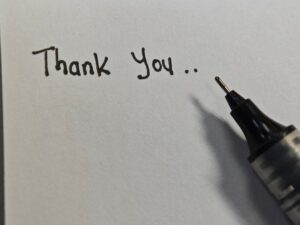 Thank,You,Written,On,White,Paper,With,Black,Pen.,Write